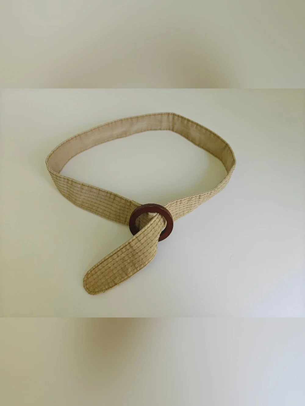 beige canvas stripe boho Y2K belt features dark brown round wooden buckle
